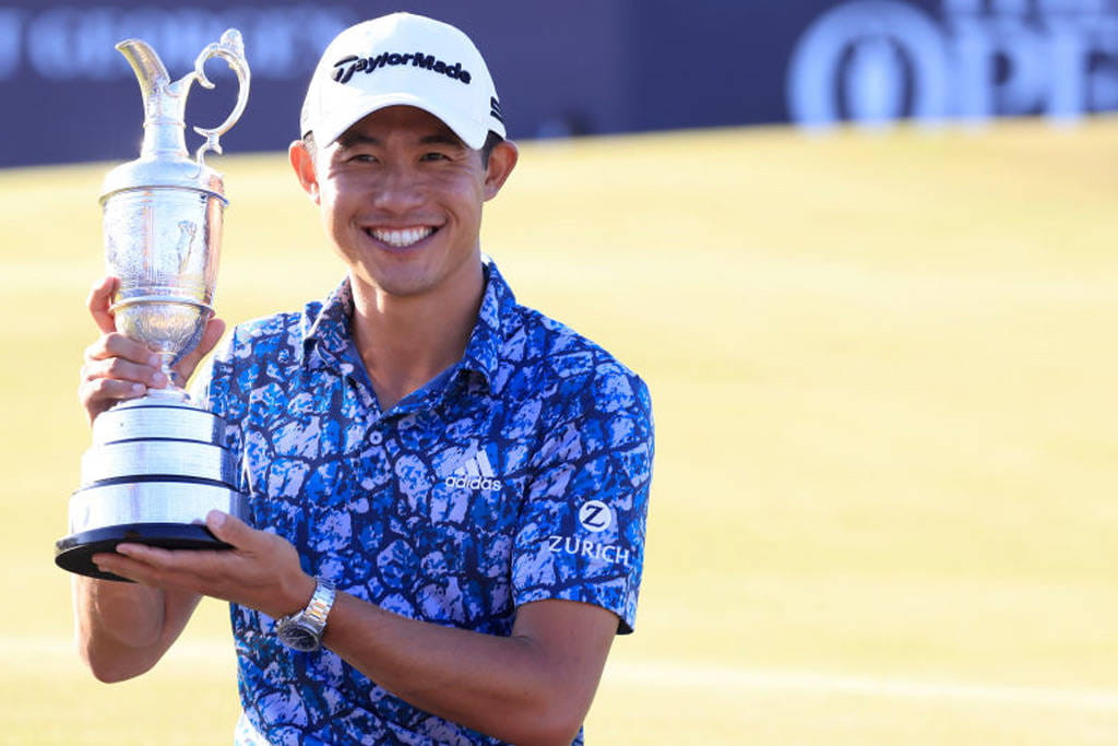 Collin Morikawa poses with the Claret Jug after winning The Open at Royal St George's in 2021
